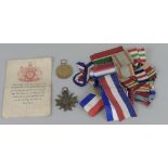 A WWII German War Merit Cross, a WWI Victory Medal awarded to 1747DA B. Codd D.H.R.N.R., a WWII