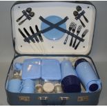 A picnic basket, the two tone blue case containing a pale blue service for four place settings, 50 x