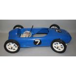 A Triang blue plastic racing peddle car, circa 1960's, not assembled, with box, length 84 cm.