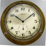 A Swiss 8 day manual bezel wind dashboard clock, the silvered dial with black Arabic numeral and