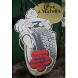 A Drive Michelin cardboard advertising sign.