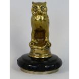 A vintage brass car mascot, modelled as an owl, mounted on a radiator cap, height 13 cm.