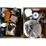 A leather suitcase of collectables, including Bakelite microphone, opera glasses, corkscrews,