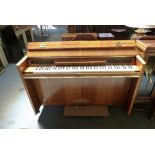 An Eavestaff oak cased Minipiano Royal with iron framed overstrung movement inscribed no. 1 serial