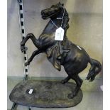 A contemporary bronze rearing horse statue, after the antique