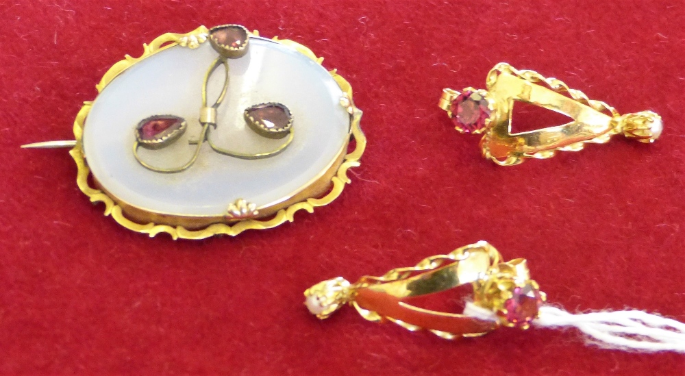 An early Victorian gold chalcedony and garnet panel brooch and a pair of gold and pearl ear pendants