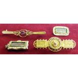 A Victorian gold panel brooch with applied bead work, two gold mourning brooches and a bar brooch (