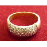 An 18ct gold and diamond dress ring, millennium hallmark, pave set with brilliant cut stones, size P