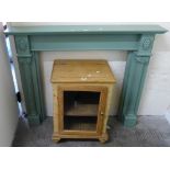 A painted pine fire surround together with pine glazed door cabinet (2)