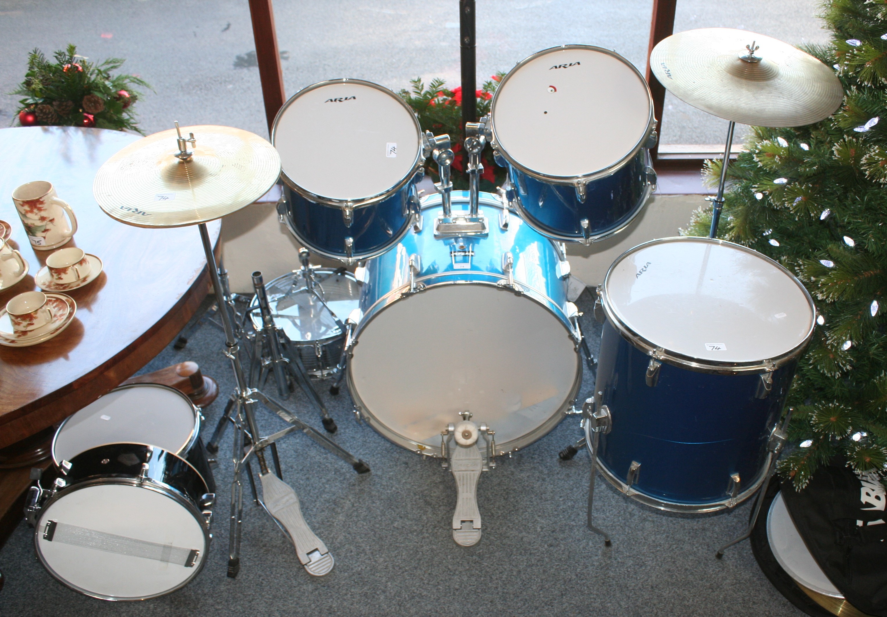 An Aria drum kit, comprising seven various drums, two other drums and various cymbals
