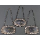 Three modern repousse silver spirit labels 37 grams