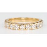 An 18ct yellow gold half eternity ring size L
