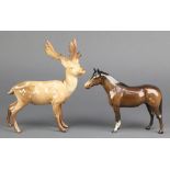 A Beswick figure of stag standing, no.981 8" together with a ditto horse 5"