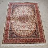 A Belgian cotton Kashan style rug with central medallion 91" x 64"