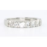 A platinum and 7 stone diamond ring, size J