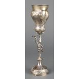 A 19th Century Hanau silver wedding cup with repousse decoration and figural stem imported by