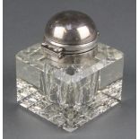 An Edwardian cut glass silver mounted inkwell, London 1903 2 3/4" There are minor chips to the glass