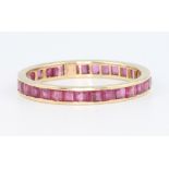 A 14ct yellow gold ruby set eternity ring size P 1/2