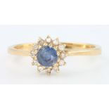 An 18ct yellow gold sapphire and diamond cluster ring size M