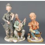 A Capodimonte figure group of 2 tramp musicians 10", ditto tramp sewing his sock 8"