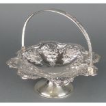 A Victorian repousse silver swing handled basket with floral and fruit decoration Sheffield 1899 9"