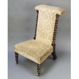 A Victorian mahogany prie-dieu chair with spiral turned columns to the sides, raised on spiral