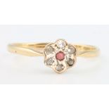 An 18ct yellow gold ruby and diamond cluster ring size O