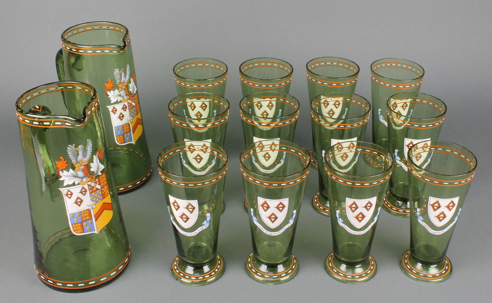 A set of 12 late 19th Century Continental green glass and enamelled beakers together with 2 jugs