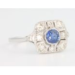 An 18ct white gold Edwardian style sapphire and diamond ring, the centre stone approx. 0.4ct