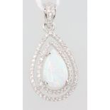 A silver pear shaped opalite and paste set pendant