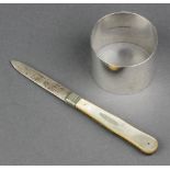 A silver napkin ring Birmingham 1912 a silver and mother of pearl fruit knife