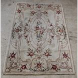 A cream and floral ground Chinese rug 95" x 61" There is some staining to this carpet