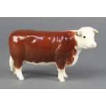 A Beswick figure - Hereford cow 1360 4 1/4"