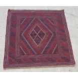 A red and blue ground tribal Gazak rug with diamond shaped medallion 49" x 47"