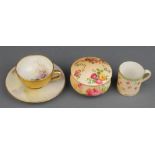 A Royal Worcester tea cup and saucer decorated with sheep signed A BarkerThe tea cup is restored