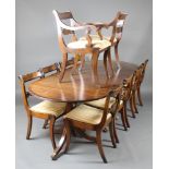 A Georgian style mahogany dining suite comprising triple pillar D end extending dining table with