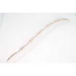 A 9ct yellow gold diamond set opaline bracelet, 7 grams