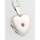 A 9ct white gold necklace with ditto gem set heart shaped locket 3.6 grams