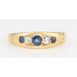 An 18ct yellow gold sapphire and diamond ring, size L 1/2