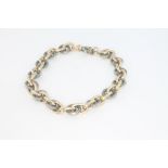 A yellow gold and silver chain bracelet