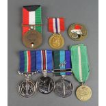 A Kuwaiti Liberation medal 1991, an Operation Iraq Freedom medallion, a group of 3 commemorative