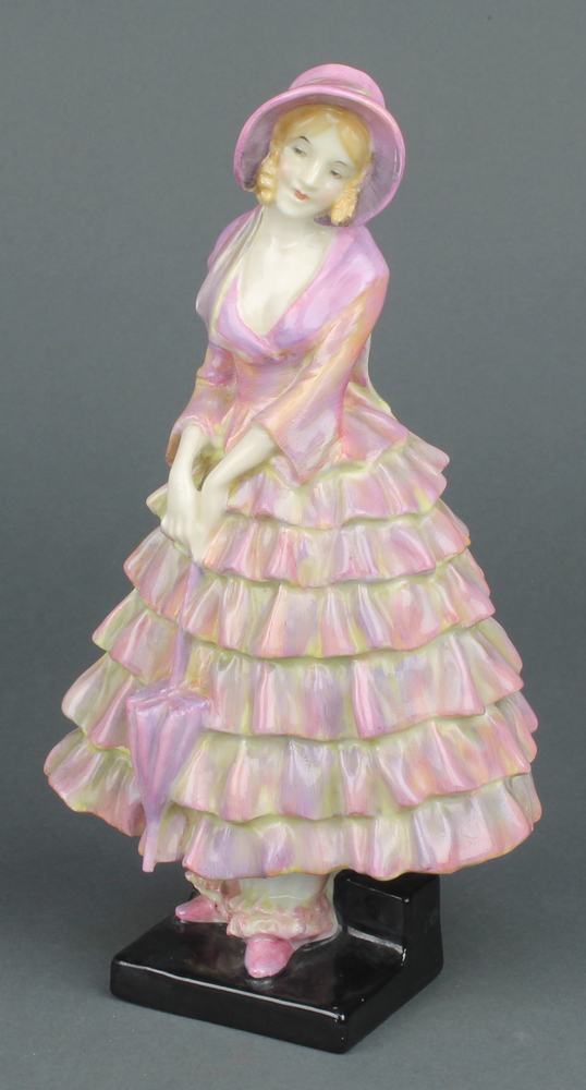 A Royal Doulton figure - Priscilla HN1337 8" There is a hair line crack to the base and the hat brim