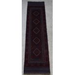 A red and blue ground Meshwani runner with 5 octagons to the centre 102" x 23"
