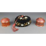 A Victorian black embroidered velvet smoking hat together with a pair of cylindrical Persian