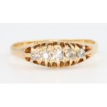 An 18ct yellow gold 5 stone diamond ring, size K 1/2