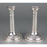 A pair of silver candlesticks with banded decoration Maker M C Hesrey & SonsLondon 1998, 6"