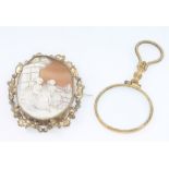 A Victorian gilt cameo brooch and a gilt eye glass