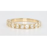 A 9ct diamond half hoop ring, approx 0.76ct, size L 1/2