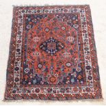 A blue and red ground Persian Qashqai with central medallion 60" x 48" There are some signs of old