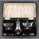 An Art Deco silver 3 piece condiment set with 2 spoons Maker I S Greenberg & Co Birmingham 1935